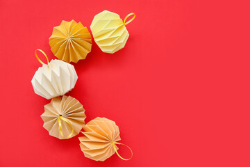 Paper Christmas balls on red background