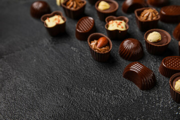 Different chocolate candies on black background