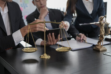 Lawyers having  Concepts of  Legal services at the law office work Legal advice online on computer labor law