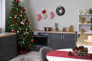 Interior of kitchen with Christmas tree, counters and socks