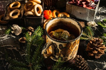 Still life- medicinal tea is a forest medicine from the polypore mushroom. Dark background- photo clipart
