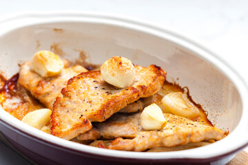 pork meat baked with garlic and onion