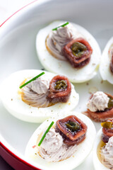 eggs filled with anchoa spread with anchoa on the top