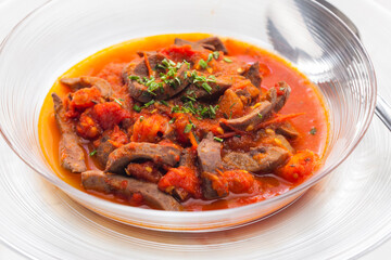 still life of kidney stew with tomatoes