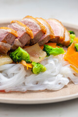 baked duck breast with vegetables and rice noodles