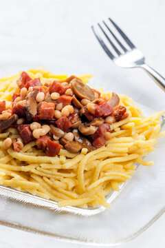 spatzles with bacon, beans and mushroom sauce