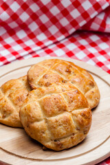 cracklings buns on wooden board