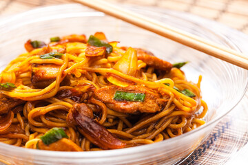 fried noodles with chicken meat in soya sauce