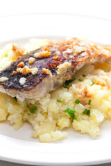 grilled carp with garlic served with mashed potatoes