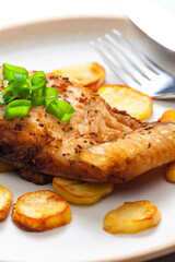 carp on cumin with fried potatoes