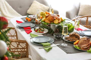 Christmas table setting with tasty ham and bread in dining room, closeup