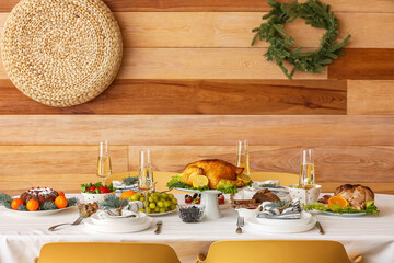 Tasty dishes for Christmas celebration on table