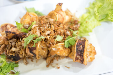 Deep fried squid with garlic. Thai style seafood appetizer