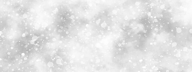 Abstract cloudy white background with snowflakes, beautiful white watercolor background with glitter particles, white bokeh background for wallpaper, invitation, cover and design.	