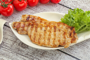 Grilled pork steak with ketchup