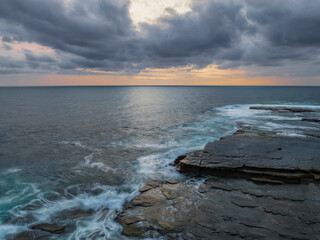 Sunrise over the sea and rocky Inlet