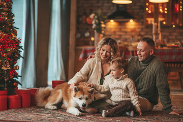 Candid authentic happy family during wintertime together enjoying holidays with dog at Xmas