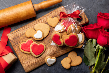Naklejka na ściany i meble Valentines day card with cookies and rose flowers