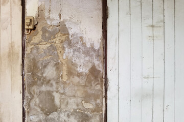 close up of wood door vintage in concrete wall 