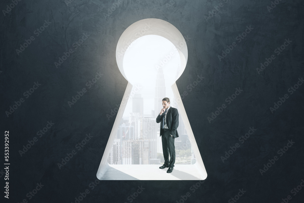 Poster abstract image of thoughtful businessman standing in keyhole opening and looking into the distance o