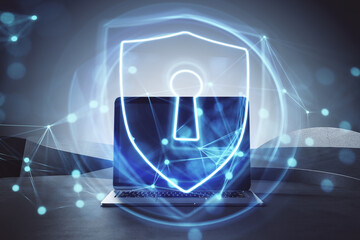 Close up of laptop with glowing secure padlock shield hologram on blurry background. Protection, safety and internet concept. Double exposure.