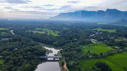 Aerial view of river with mountains in background. Kerala village view