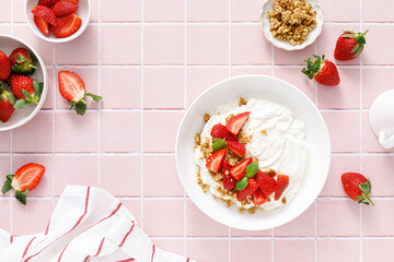 Yogurt with strawberry. Plain white greek yogurt with fresh berries and granola. Healthy food, breakfast. Top view - 553394343