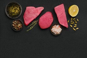 Top view of raw fresh tuna steak and spices