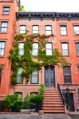 Ivy covers brick walls of stunning apartment building in Greenwich Village New York City