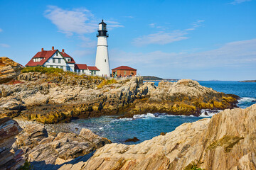 Beautiful Portland Head Lighthouse on rocky coasts of Maine