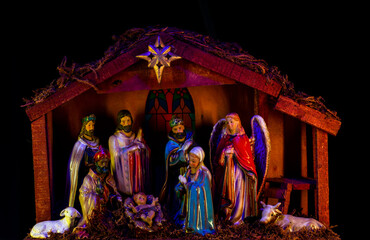 Nativity of Jesus. Christmas Manger scene with figures of Jesus, Mary, Joseph, sheep and magi.
