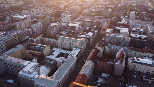 City blocks during the sunset. Urban landscape. Dolly forward drone shot