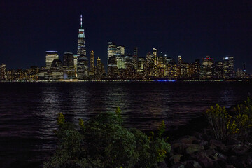 New York City skyline at night from New Jersey coast with city lights