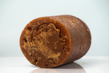 brown sugar made from palm trees on white background