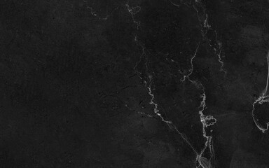 Texture of dark gray marble with light veins. Abstract granite stone. Natural stone wallpaper