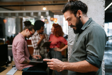 Programmers cooperating at IT company developing apps. People business work office concept