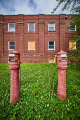 Traverse City rusted utility posts outside of abandoned brick hospital in America