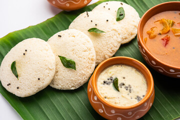 Idly sambar or Idli with Sambhar and green, red chutney. Popular South indian breakfast