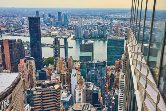 Edge High Up Of Skyscraper Wall Overlooking New York City Manhattan Skyline From Above