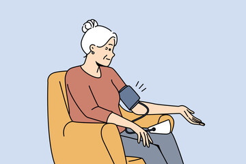 Older woman sitting in chair measuring blood pressure with tonometer. Mature grandmother check health make measurement with electronic device. Vector illustration. 