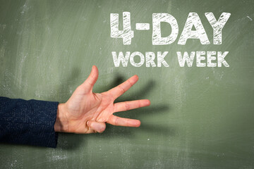 4-day work week. Green chalkboard background and female hand