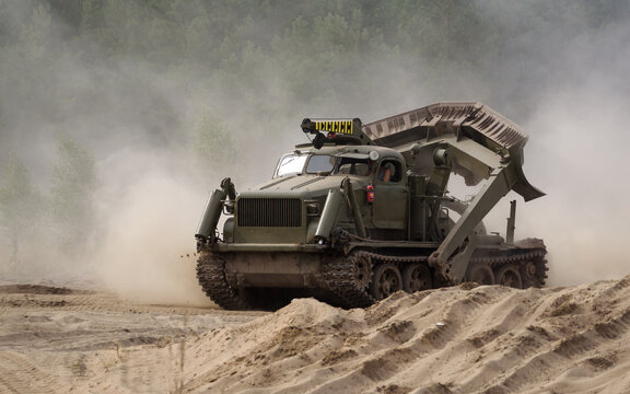 BORNE SULINOWO, WEST POMERANIAN - POLAND - 2022: 
Military high speed dozer for sapper and engineering work is driving in the off-road