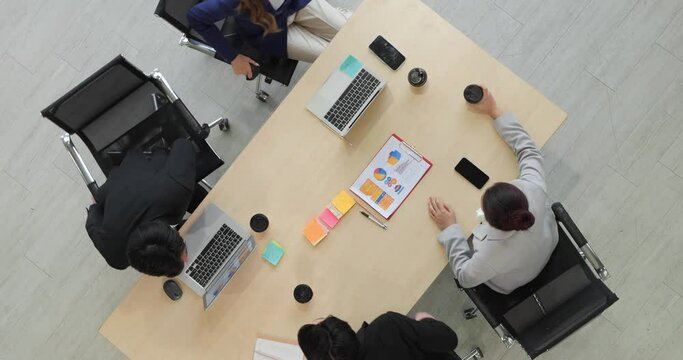 Top view of young asian businesspeople team meeting and discussing in the conference room at the office