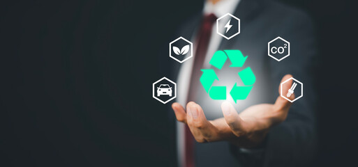 Businessman hand hold recycle symbol connection with virtual modern reduce CO2 emission concept...