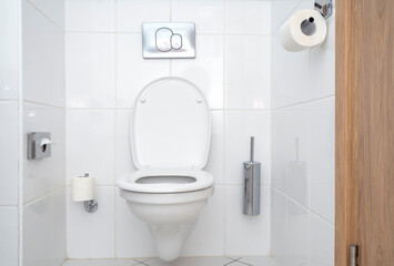 Interior of toilet with white ceramic toilet bowl. Modern minimal style of bathroom in hotel.