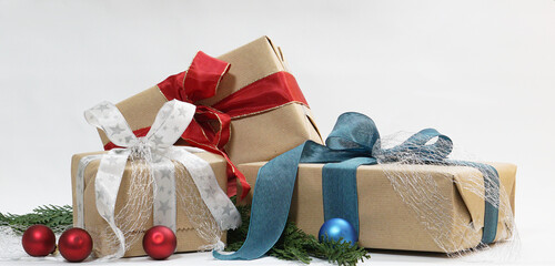 Christmas gifts. Christmas presents with ribbon around brown wrapping paper