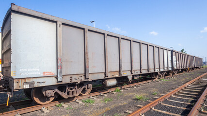 Fototapeta na wymiar Railway Train Cargo Wagon Trailers Enclosed Yard