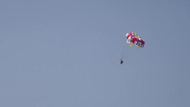 Closed shot of a person practicing parasailing