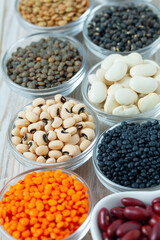Lentils, legumes and beans on white surface