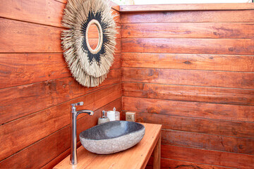 Luxury safari camp bathroom in the middle of the bush in Southern Africa. The bright white...